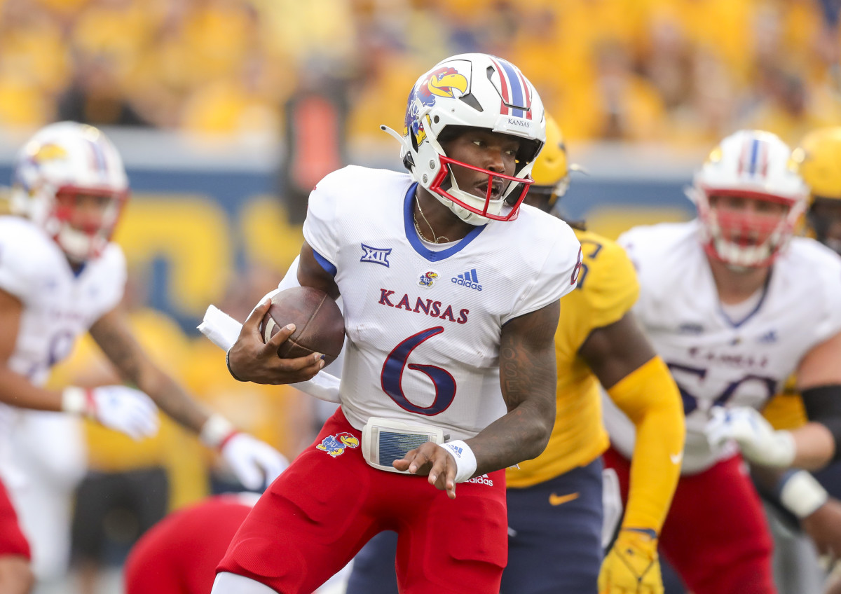 Sep 10, 2022; Morgantown, West Virginia, USA; Kansas Jayhawks quarterback Jalon Daniels (6) runs the ball during the first quarter against the West Virginia Mountaineers at Mountaineer Field at Milan Puskar Stadium. Mandatory Credit: Ben Queen-USA TODAY Sports